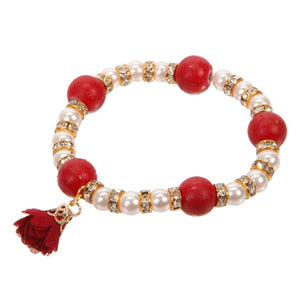 Pulsera Con Cuenta Roja Y Dije De Flor